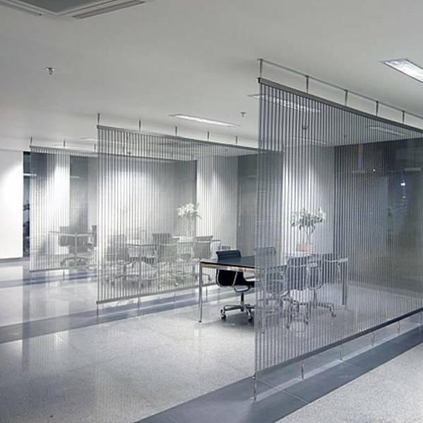 Argger architectural mesh acts as reception room partitions.