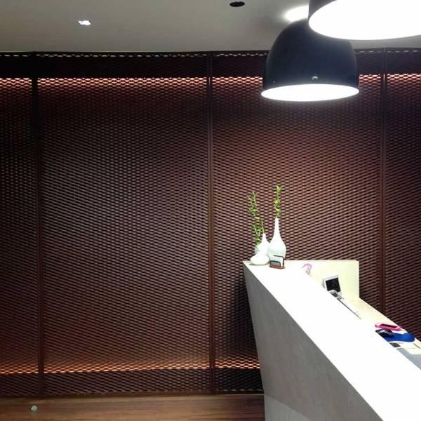Argger architectural mesh functions as the reception wall coverings.