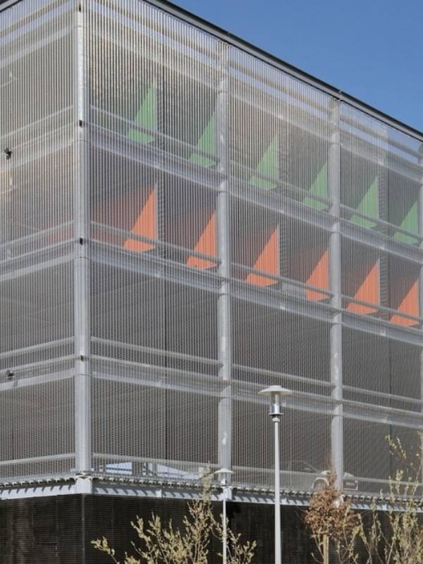 Argger architectural mesh is used as parking screen in commercial parking lots.
