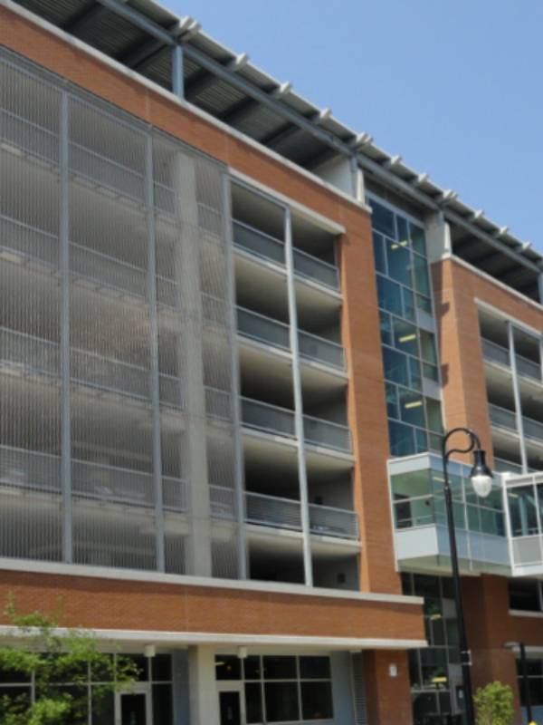 Argger architectural mesh is used as parking screen in hotel parking lots.