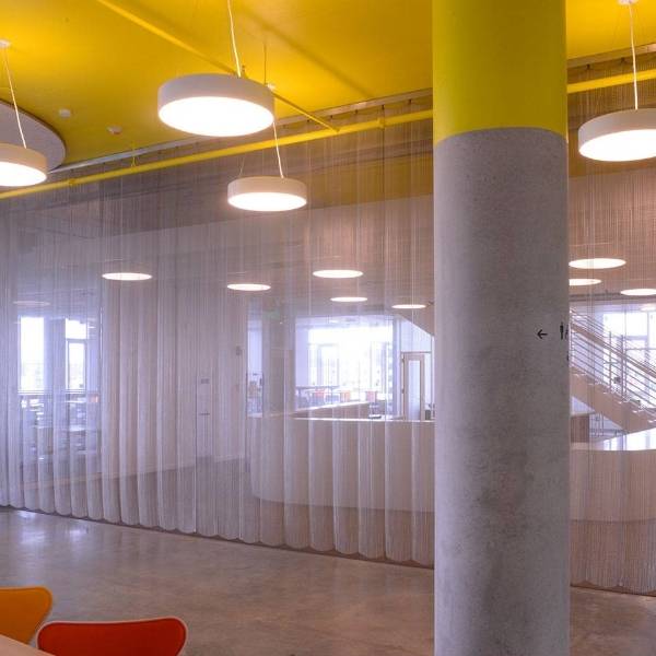 Argger architectural mesh acts as office partitions.