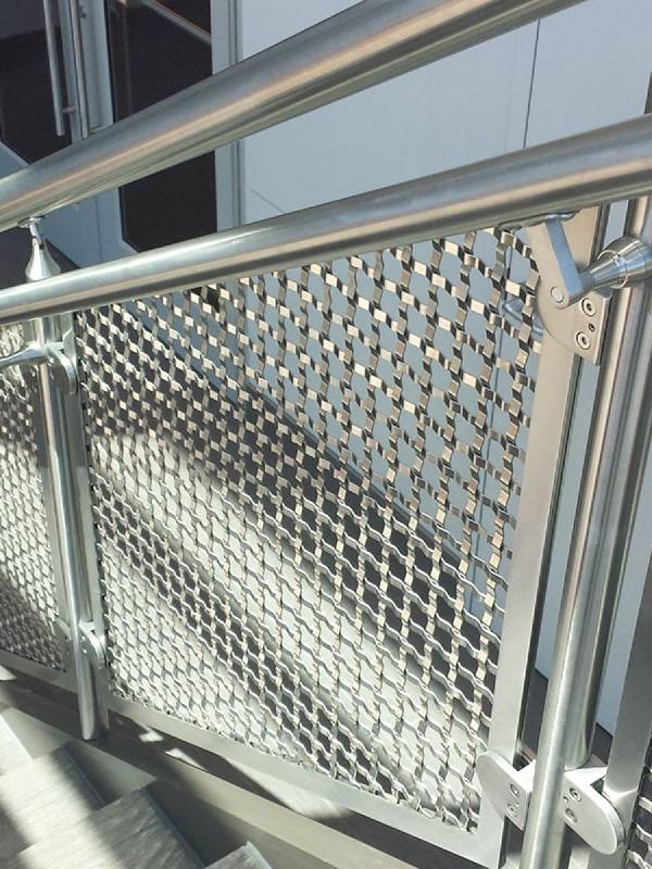 Argger architectural mesh functions as stair handrail.