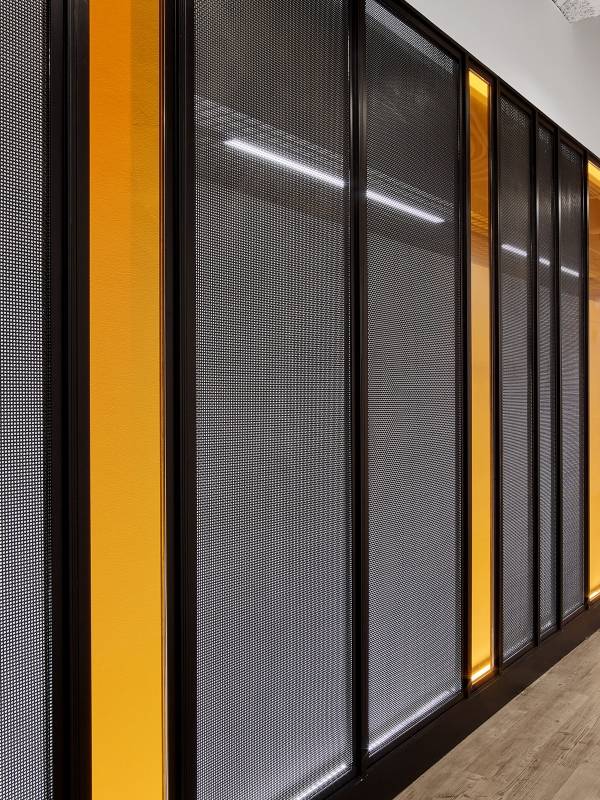 Argger decorative mesh functions as wall coverings in hallway.