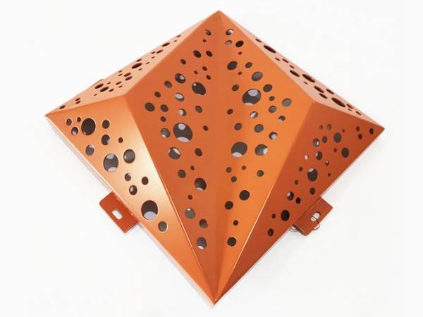 An orange 3D aluminum perforated panel with round hole patterns