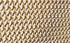 A detail view of Athena-1420D weave close architectural mesh.