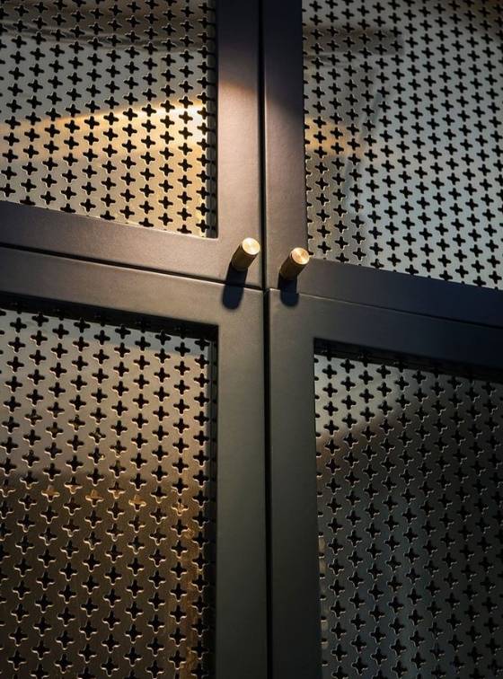 The door is made of clover perforated metal.