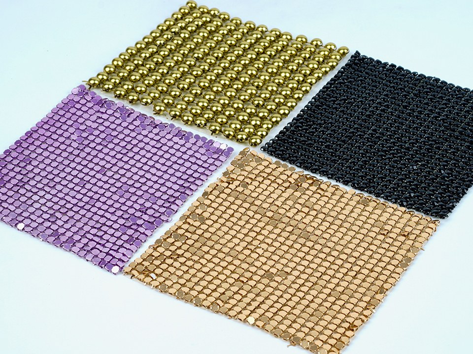 Four pieces of different colors and patterns of scale mesh curtain.