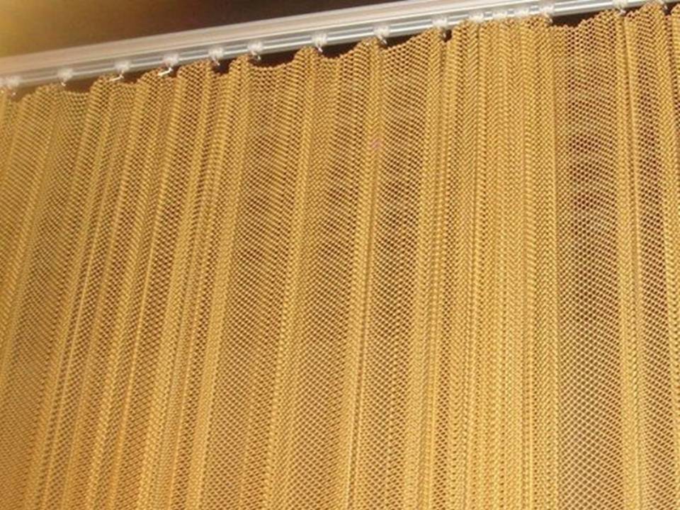 Metal decorative mesh serves as bedroom curtain.