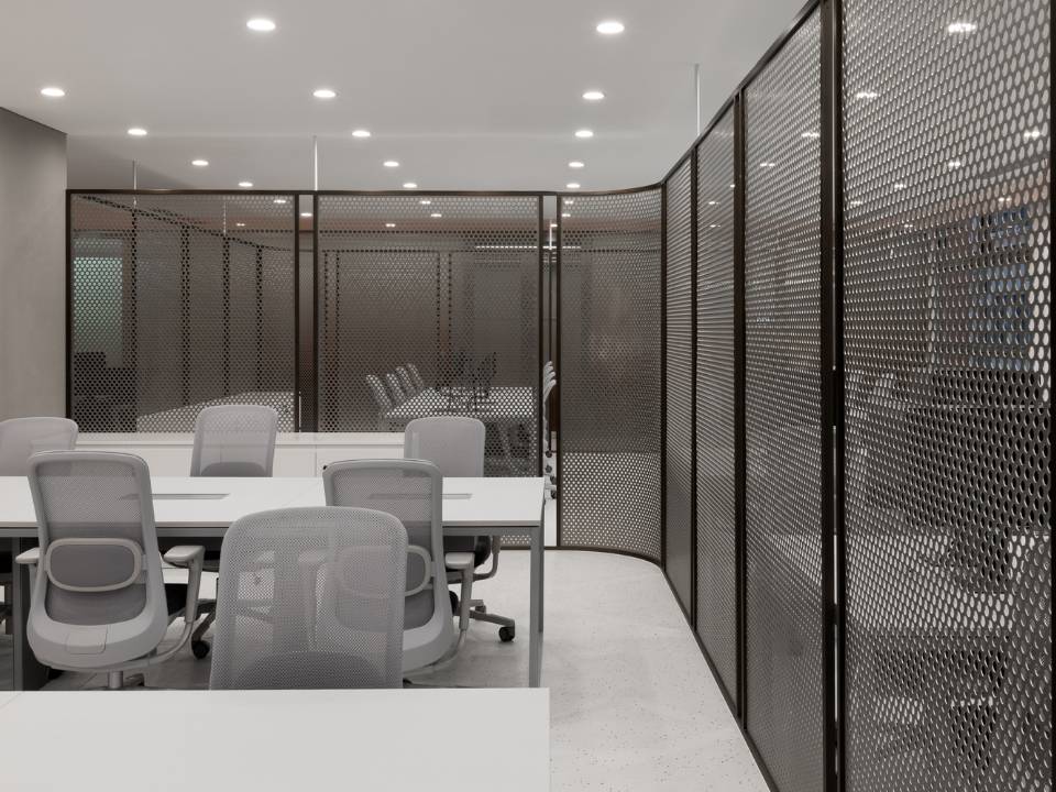 Metal decorative mesh serves as office partitions.