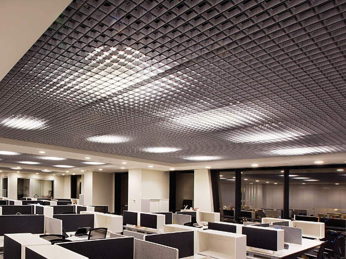 Office decorated with metal grating suspended ceiling