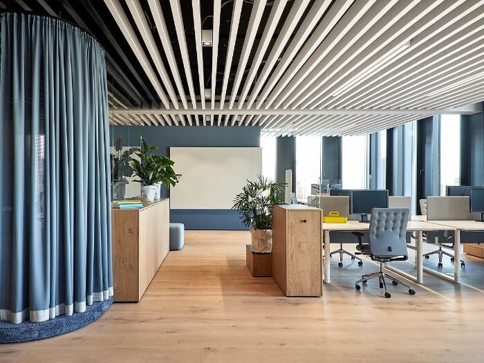 Office decorated with metal bar ceiling