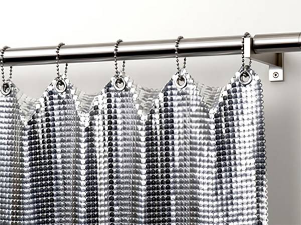 The side view of scale metal curtain installation with bead chains.